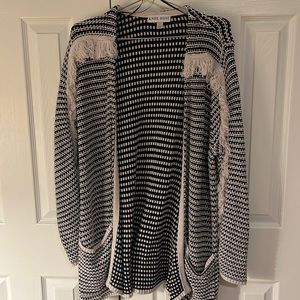 Cardigan with a fringe style detail. Size LRG. Gently used. Smoke free home